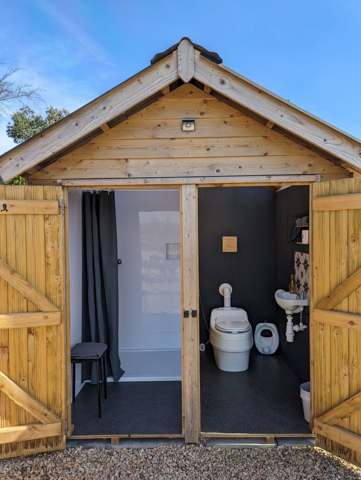 Outdoor wash hut with shower side and compost toilet